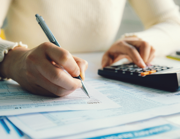 Woman in blouse filing taxes