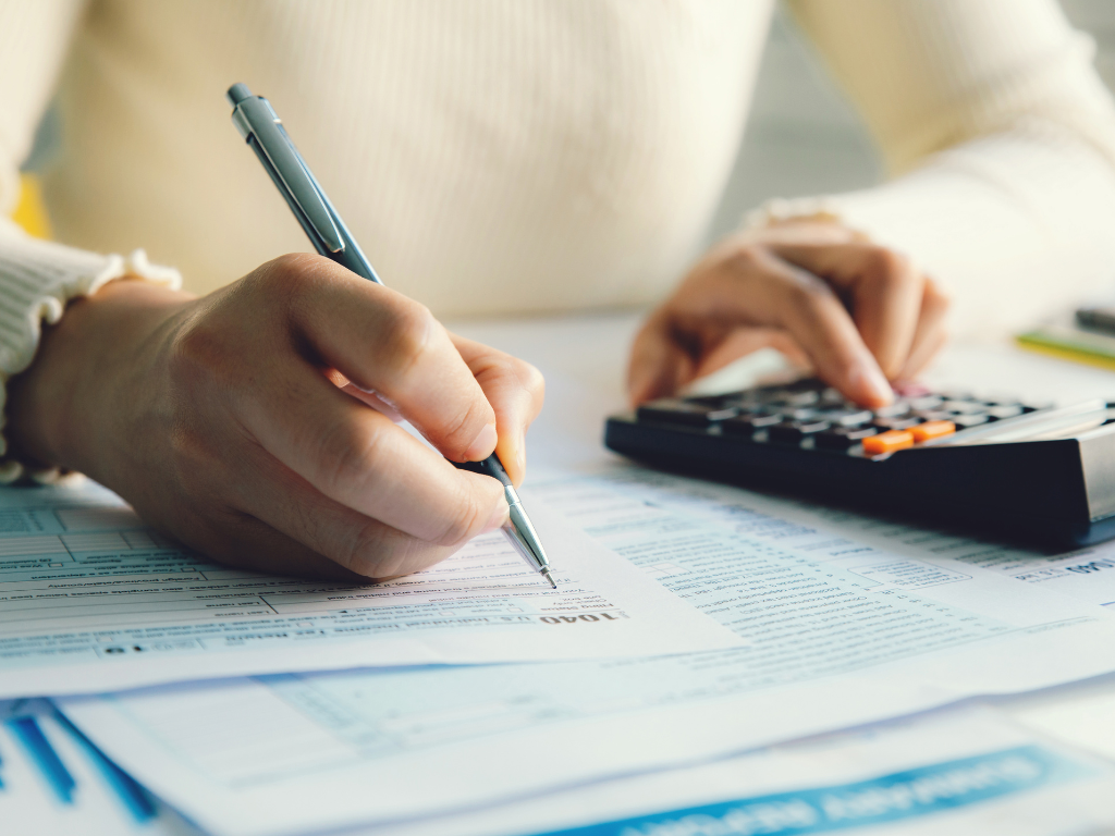Woman in blouse filing taxes