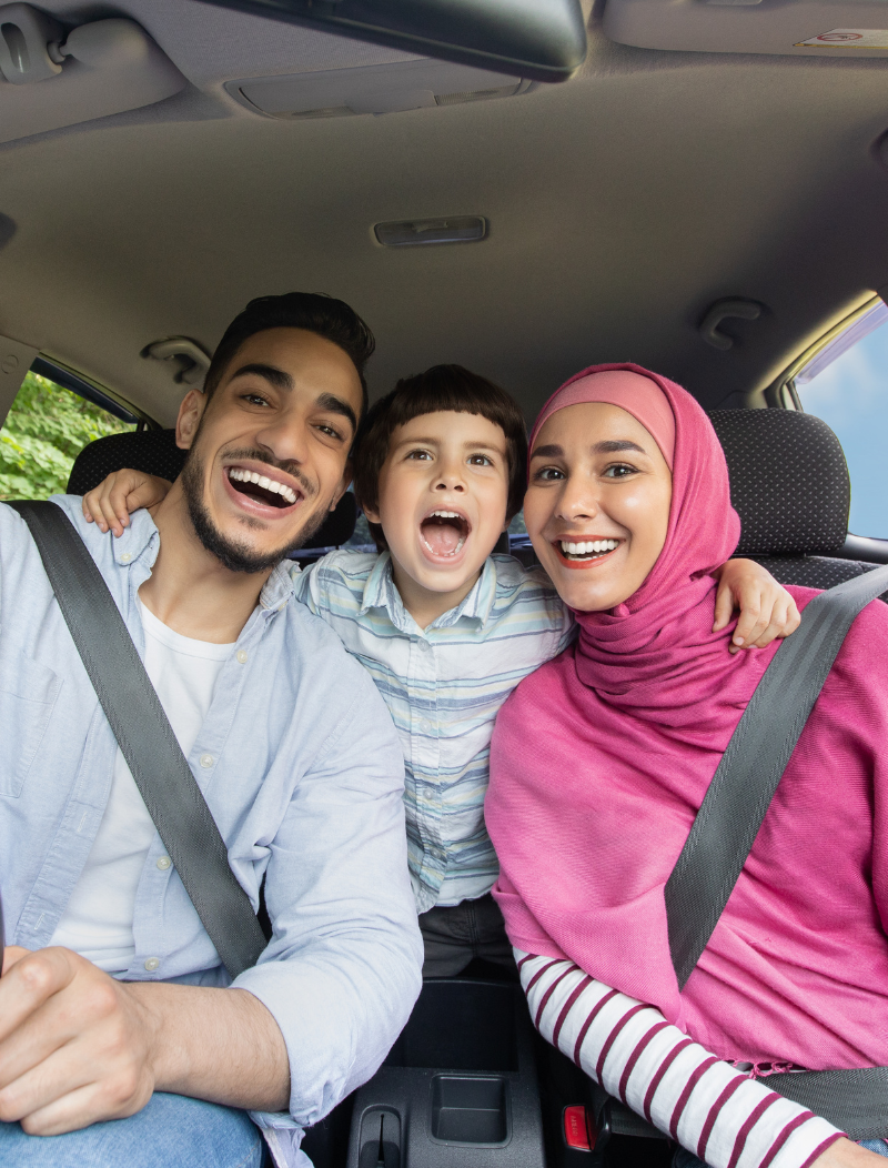 Happy muslim family in car