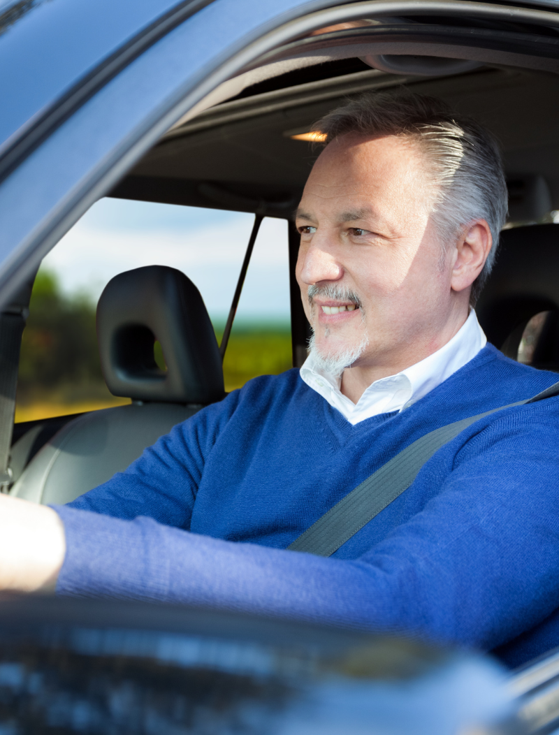 Older gentleman driving car